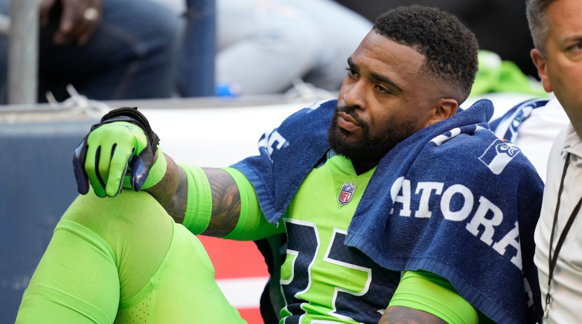 Seahawks safety Jamal Adams is taken off the field on a cart after an injury during the first half of a game against the Broncos.